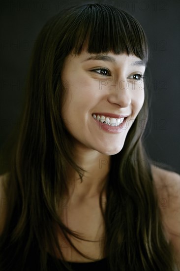 Mixed race woman smiling