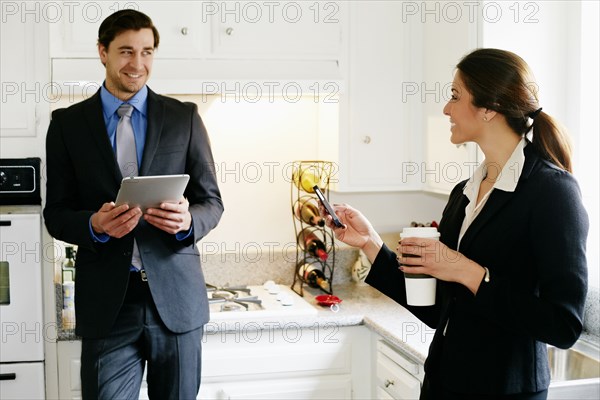 Couple talking in kitchen