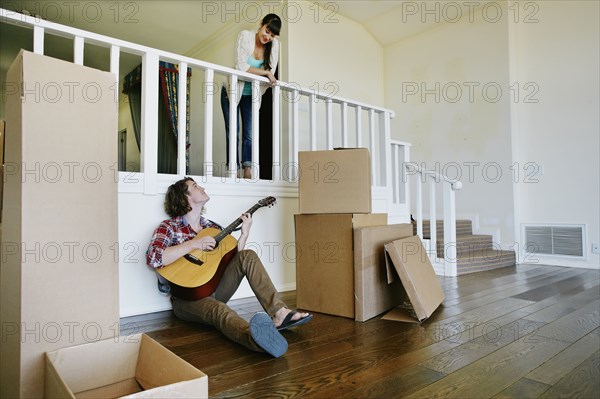 Couple relaxing in new home