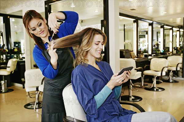 Woman having hair cut in salon
