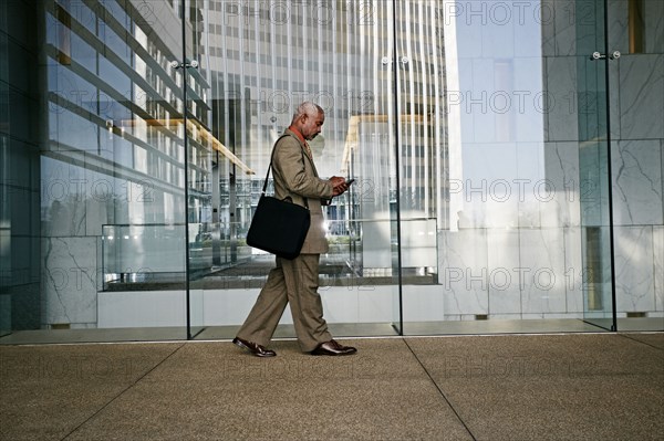 Black businessman using cell phone