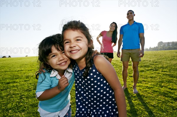 Girls smiling together in field