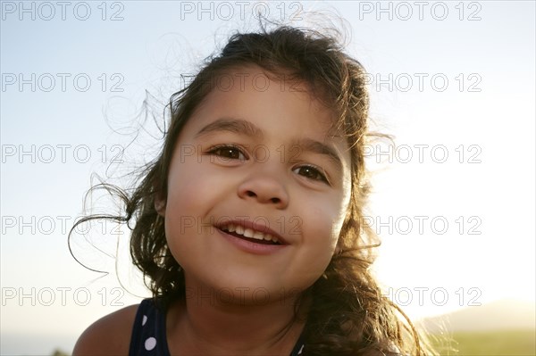 Mixed race girl smiling outdoors