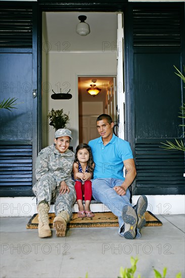 Soldier mother with daughter and husband