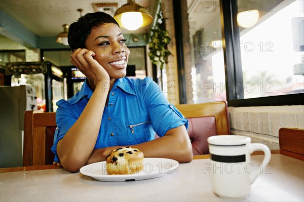 African American woman smiling in restaurant