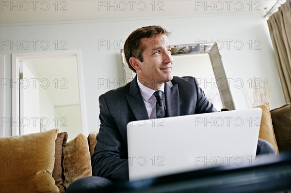 Caucasian businessman using laptop