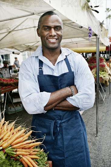 Black man working at outdoor market