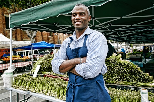 Black man working at outdoor market