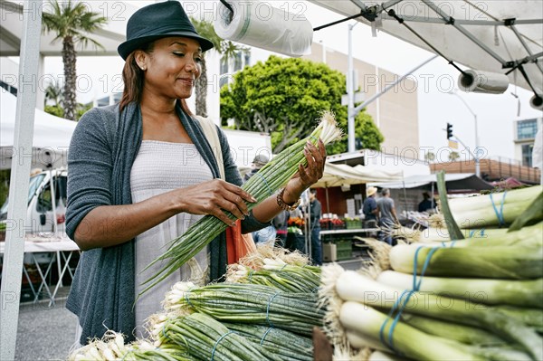 Black woman shopping at outdoor market