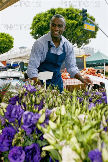 Black man working at outdoor market