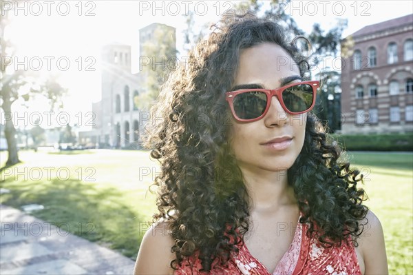 Mixed race student walking on campus