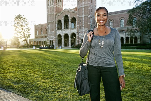 African American professor smiling on campus