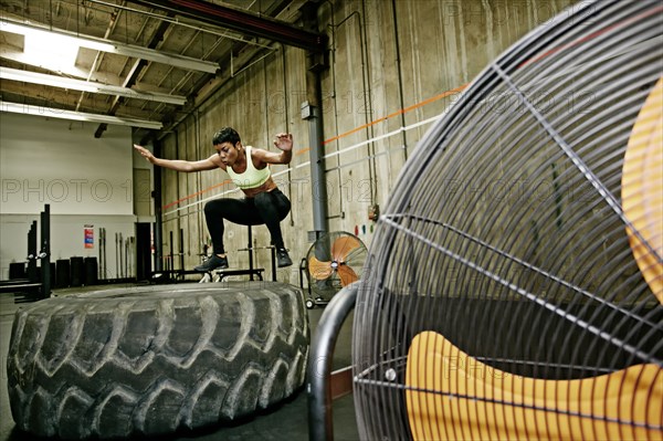 Black woman exercising in gym