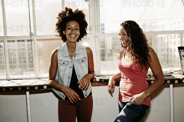 Women smiling together