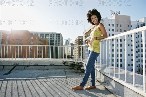 Mixed race woman on urban rooftop