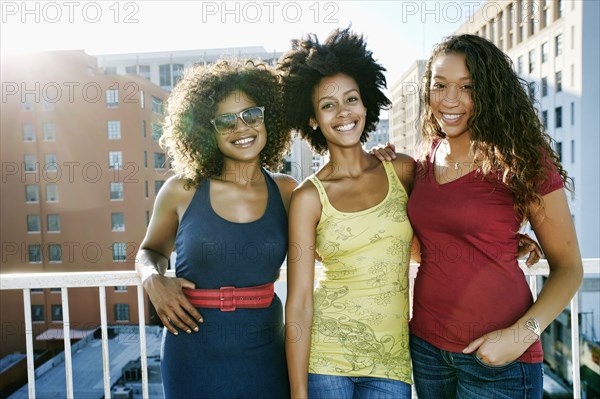 Mixed race women on urban rooftop