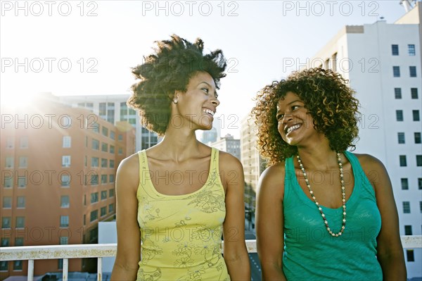 Mixed race women on urban rooftop