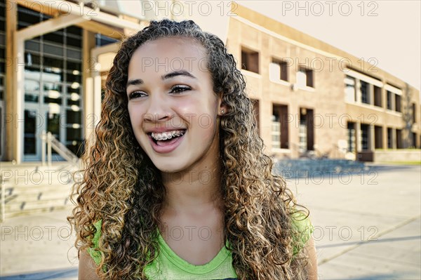 Mixed race girl smiling outdoors