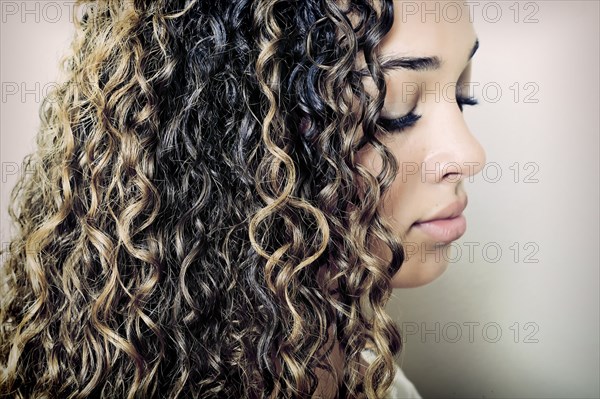 Close up of mixed race girl looking down