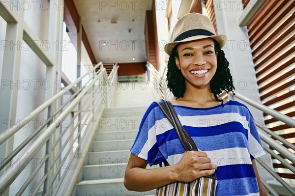 Black woman walking down steps