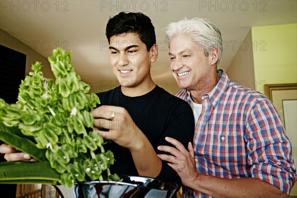 Homosexual couple arranging flowers