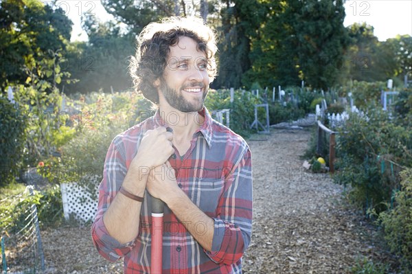 Caucasian man standing in garden