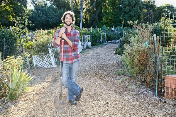 Caucasian man standing in garden