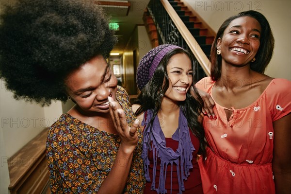 Women laughing in apartment building