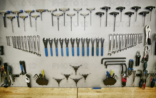Tools arranged neatly on shop wall