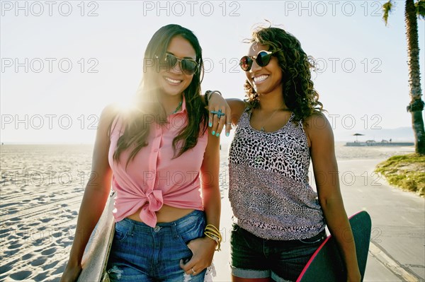 Women walking together on beach