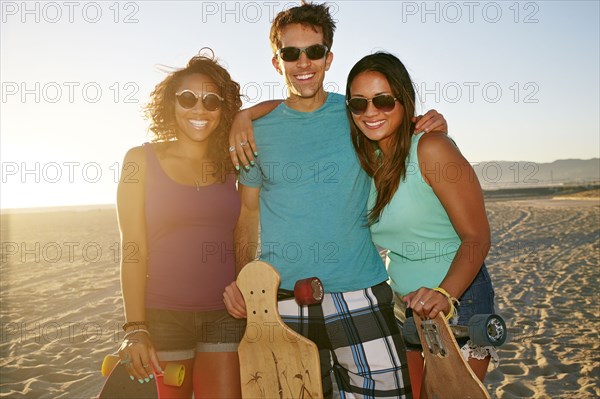 Friends smiling on beach