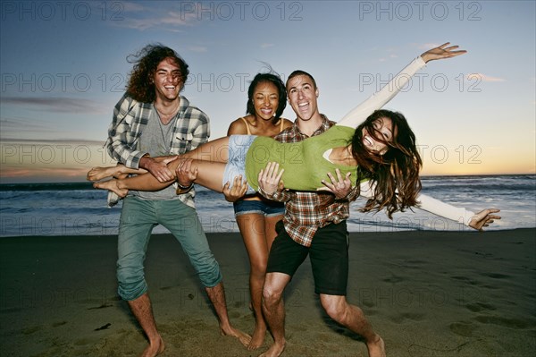 Friends posing together on beach