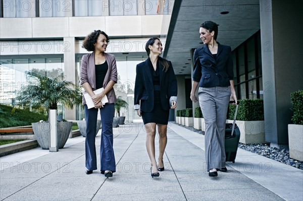 Businesswomen walking together outdoors