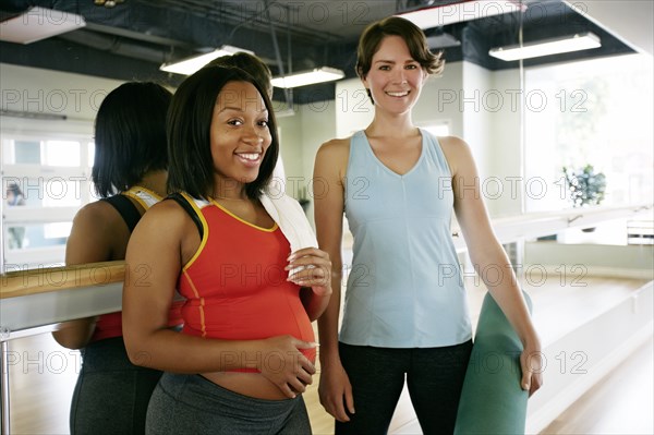 Women smiling in yoga studio