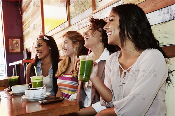 Women relaxing together in cafe