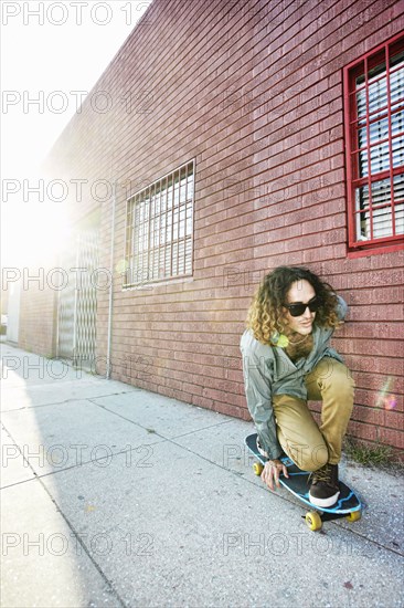 Man riding skateboard on city street