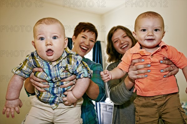 Caucasian mothers holding babies