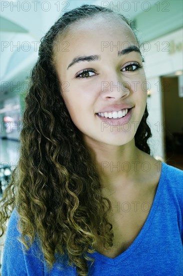 Close up of mixed race teenage girl smiling