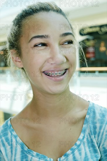 Close up of mixed race teenage girl smiling