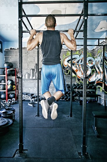 African American man exercising in gym