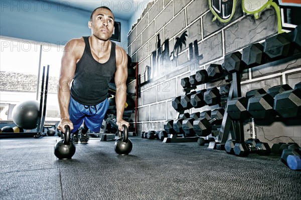 African American man exercising in gym