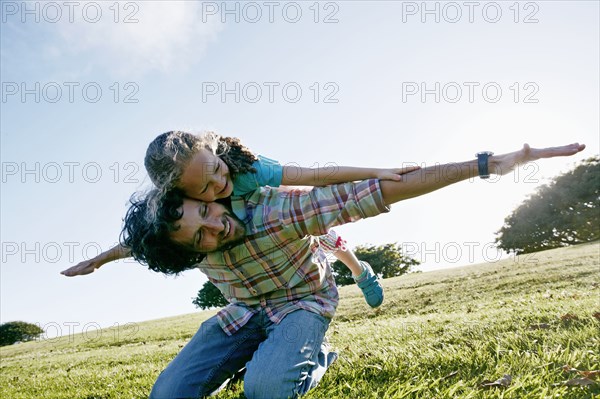 Father and daughter playing outdoors