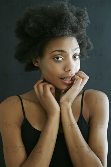 Close up of black woman biting fingernails