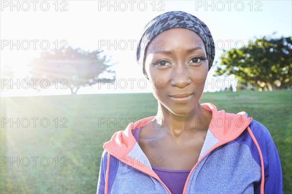 African American woman smiling in park