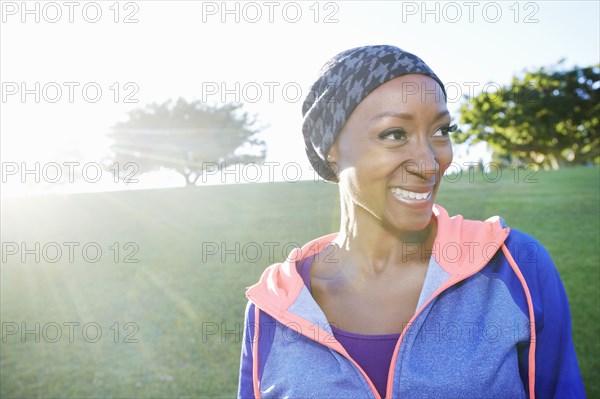 African American woman smiling in park