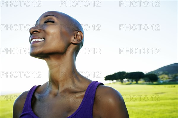 African American woman smiling in park