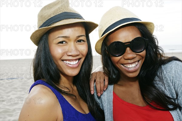 Close up of women smiling on beach