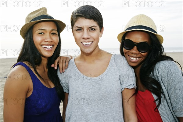 Close up of women smiling on beach