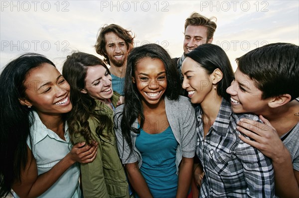 Close up of friends laughing outdoors