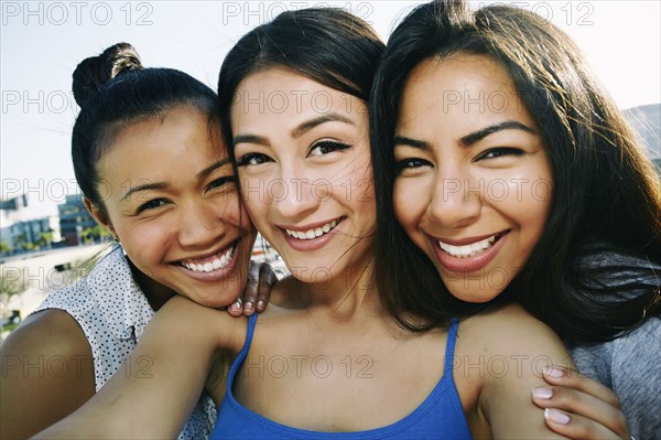 Women taking selfie on urban rooftop